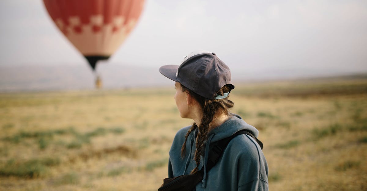 What kind of documentation do I need to fly alone within Europe, when under 18? - Anonymous woman and air balloon in field What kind of documentation do I need to fly alone within Europe, when under 18? - Anonymous woman and air balloon in field