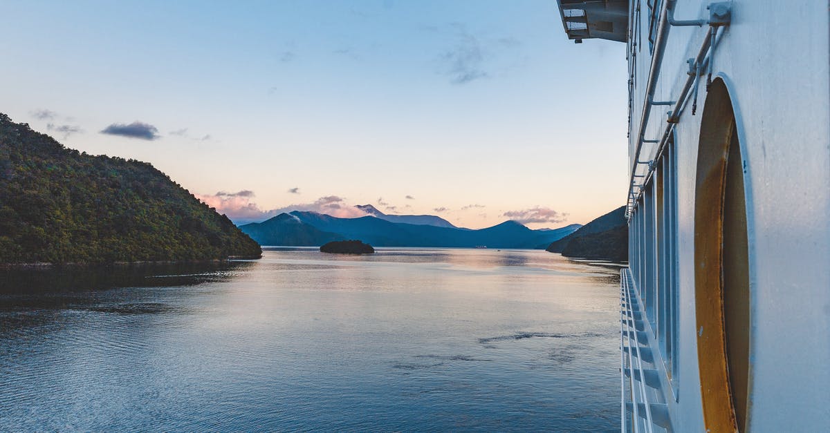 What kind of evidence is acceptable as proof of funds for a New Zealand vacation? - Close-up Photography of Gray Boat on Body of Water