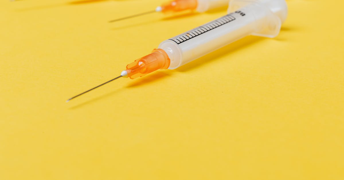 What kind of PCR test does England use for Day 2 testing? - Medical single use disposable syringe without protective cover on needle and with empty barrel placed on bright yellow surface What kind of PCR test does England use for Day 2 testing? - Medical single use disposable syringe without protective cover on needle and with empty barrel placed on bright yellow surface