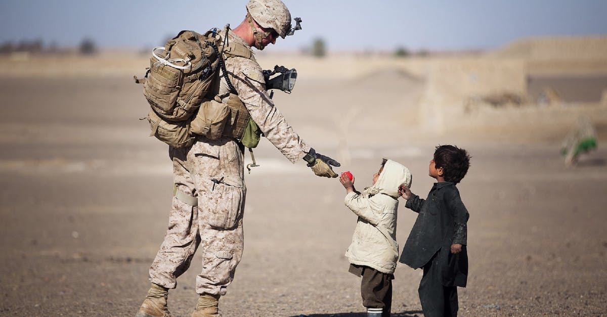 What kind of proof of residency is accepted by Disneyland? - Soldier Giving Red Fruit on 2 Children during Daytime What kind of proof of residency is accepted by Disneyland? - Soldier Giving Red Fruit on 2 Children during Daytime