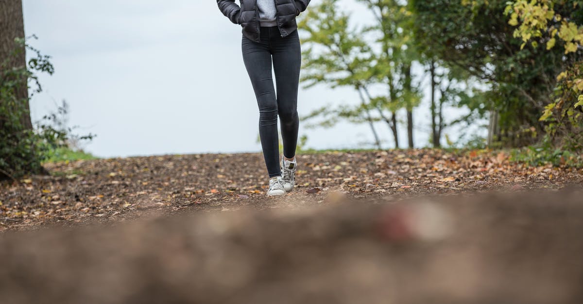 What kind of trousers or shorts are suitable for long-distance summer walking / hitchhiking? - Woman in Black Leggings While Walking on Brown Road What kind of trousers or shorts are suitable for long-distance summer walking / hitchhiking? - Woman in Black Leggings While Walking on Brown Road