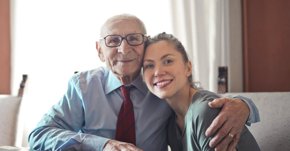 What kind of visa do I need for a partially paid internship in Spain? - Positive senior man in formal wear and eyeglasses hugging with young lady while sitting at table What kind of visa do I need for a partially paid internship in Spain? - Positive senior man in formal wear and eyeglasses hugging with young lady while sitting at table