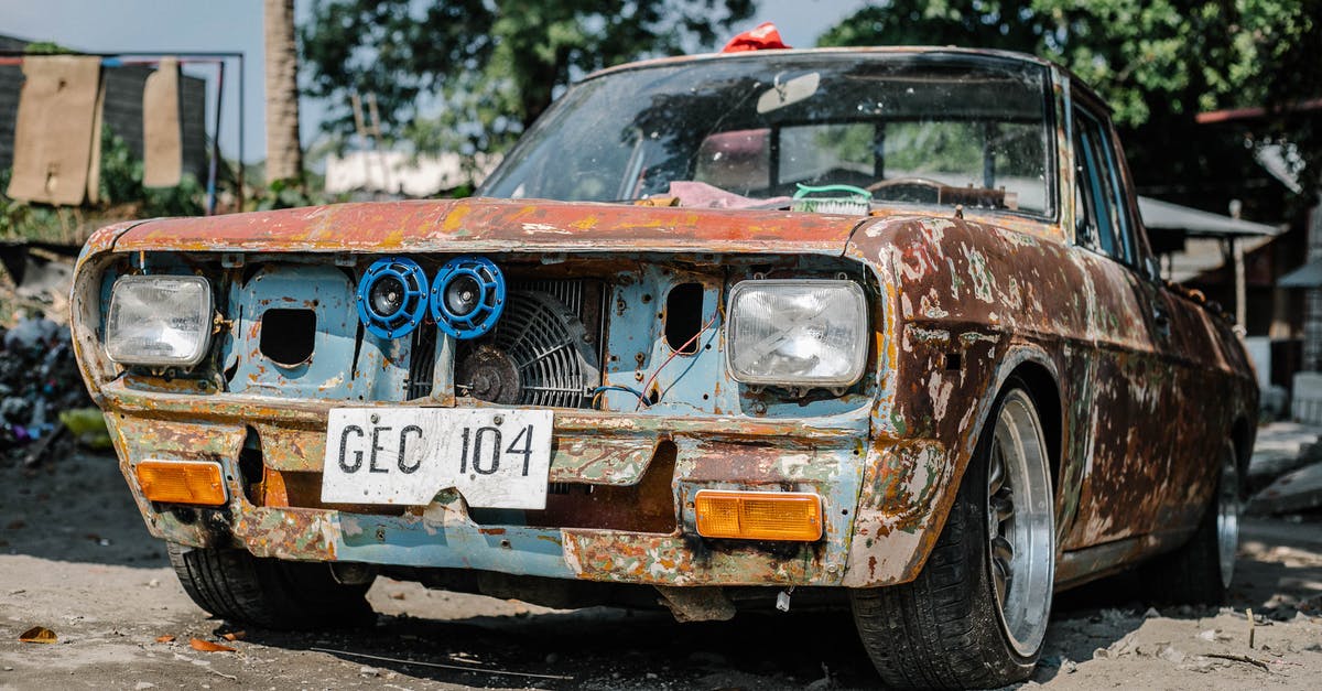 What needs to be done locally in case of a car accident while travelling in the US? - Classic Red Vehicle