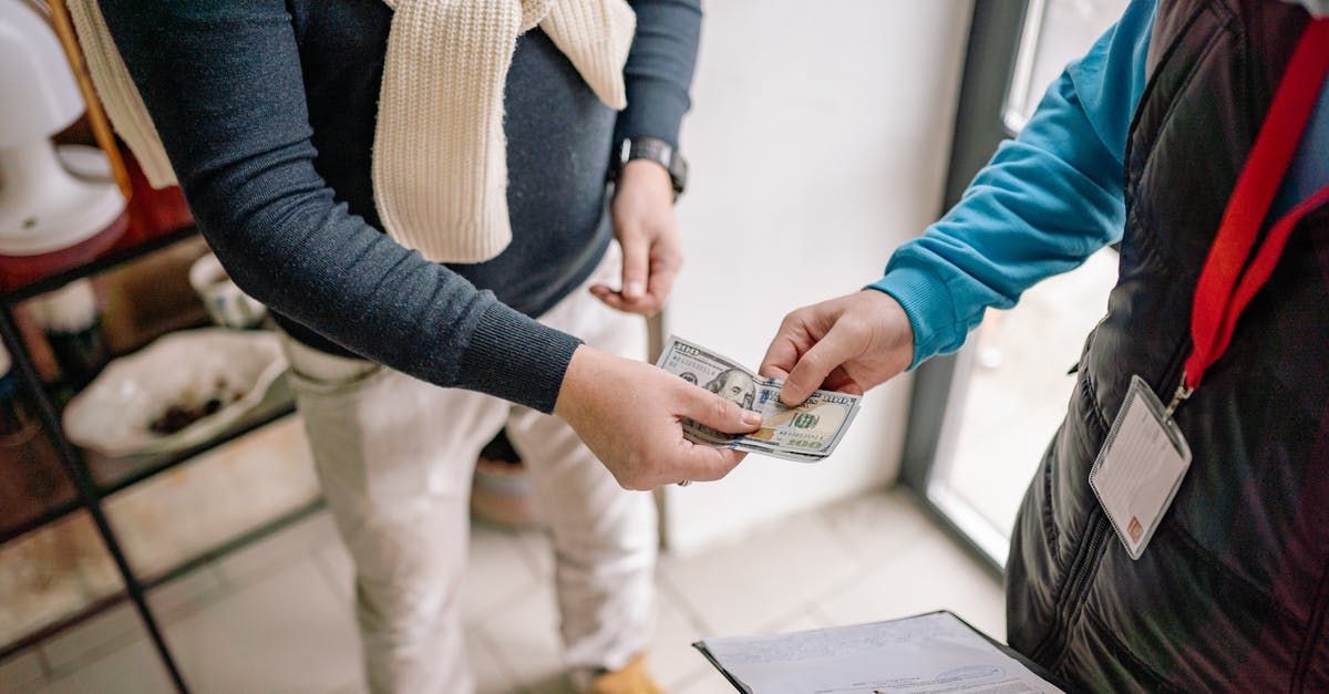 What needs to be paid in cash on an all-inclusive Egypt vacation? [closed] - A Person Holding Money