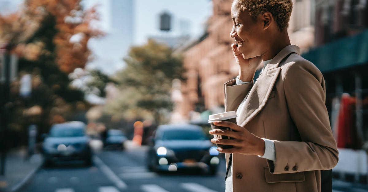 What paperwork is needed to cross non-EU Balkan borders with a rental car? - Happy black businesswoman having phone call What paperwork is needed to cross non-EU Balkan borders with a rental car? - Happy black businesswoman having phone call