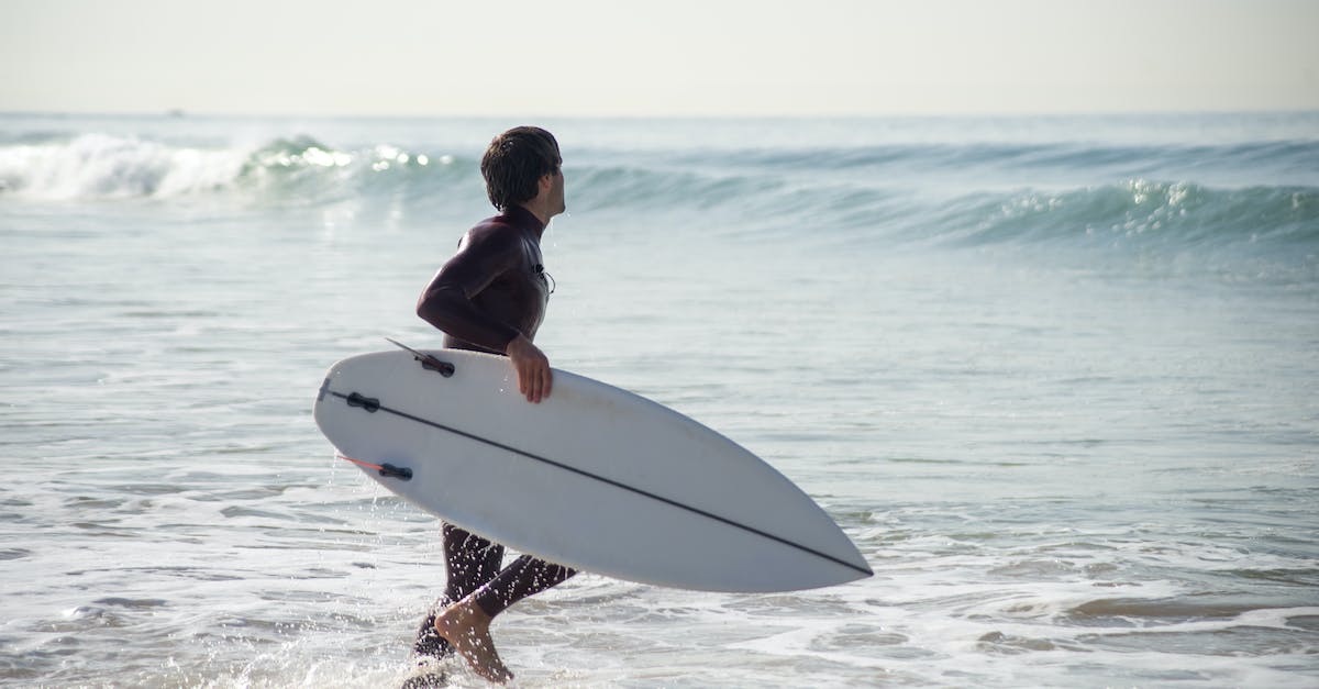 What parts of the Central or South Coast of California should I consider when looking for a surfing beach with beachfront hotels? - A Man Holding his Surfboard What parts of the Central or South Coast of California should I consider when looking for a surfing beach with beachfront hotels? - A Man Holding his Surfboard