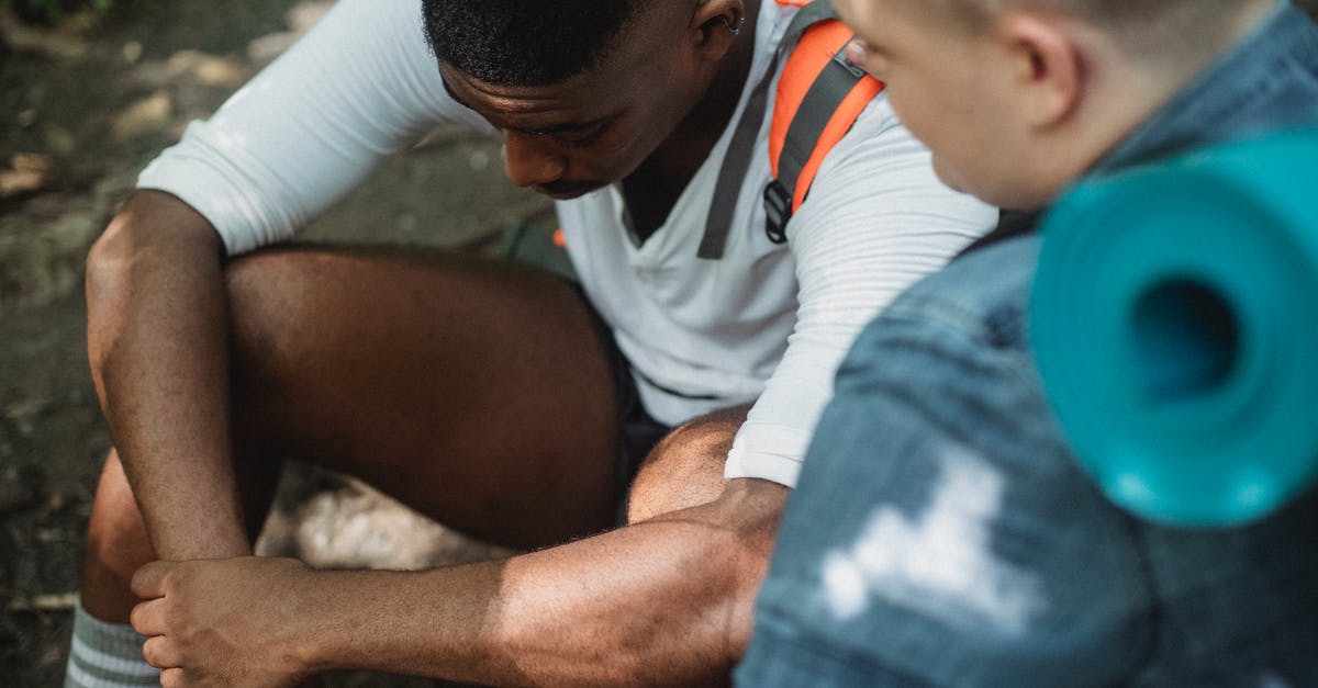 What proof of negative test do I need before travelling to Belgium from UK? - Black exhausted traveler resting on ground What proof of negative test do I need before travelling to Belgium from UK? - Black exhausted traveler resting on ground