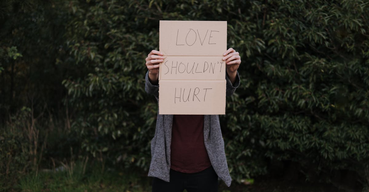 What should I do to avoid ear pain when flying? - Anonymous female with poster about hurtful love in nature What should I do to avoid ear pain when flying? - Anonymous female with poster about hurtful love in nature