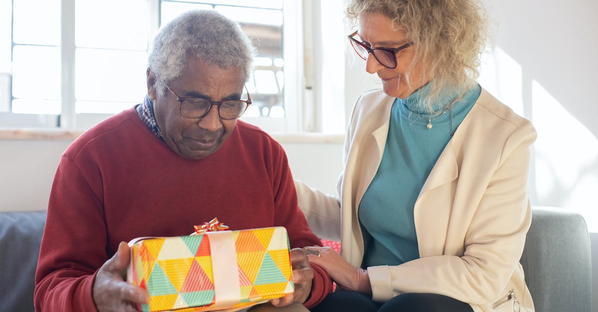 What should we consider when buying a gift for a host family in Turkey? - Man in Beige Blazer Holding Yellow and Red Book What should we consider when buying a gift for a host family in Turkey? - Man in Beige Blazer Holding Yellow and Red Book