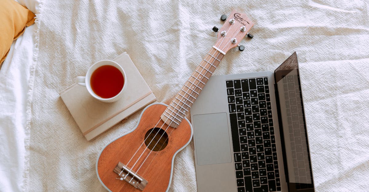 What should we plan to see on a weekend in Belfast? [closed] - Top view of morning learning ukulele play process in bed