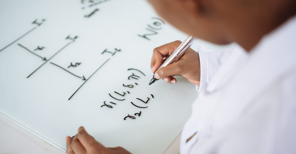 What sort of Covid test do I need to board a Ryanair flight from Spain to England? - From above anonymous ethnic student wearing uniform and solving problem in chemistry while writing formula on white table in lab What sort of Covid test do I need to board a Ryanair flight from Spain to England? - From above anonymous ethnic student wearing uniform and solving problem in chemistry while writing formula on white table in lab
