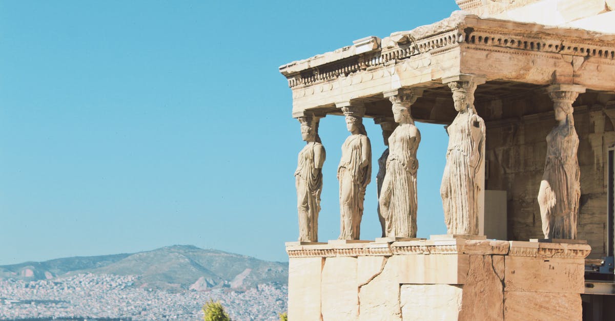 What statue is this in Athens near the Acropolis? - Concrete Statue Under the Blue Sky