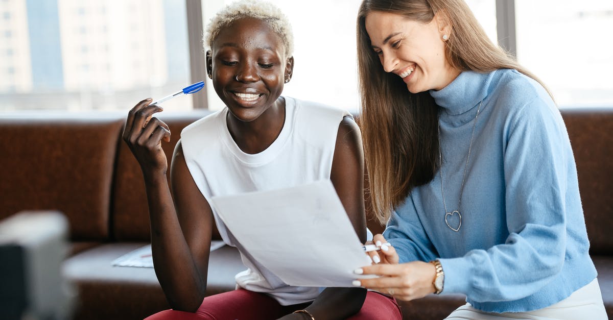 What to do for Immigration check when you have US visa & the parent company has changed its name? - Positive diverse women checking information in document of agreement and smiling together in office What to do for Immigration check when you have US visa & the parent company has changed its name? - Positive diverse women checking information in document of agreement and smiling together in office