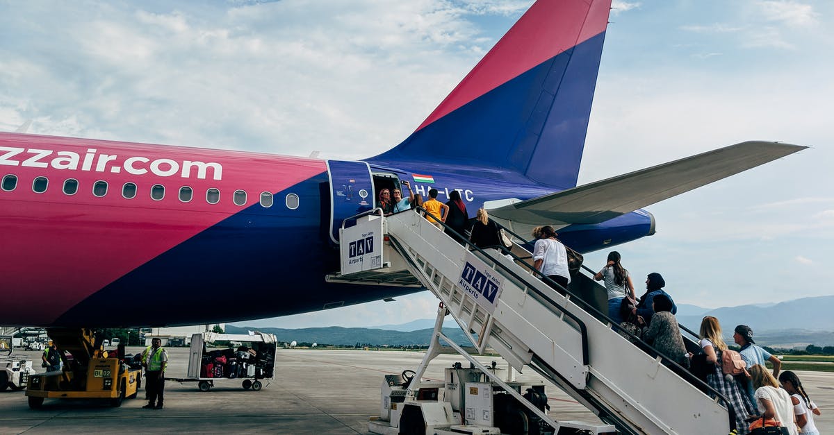 What to do if denied boarding due to the airlines' fault? - People Walking Inside Airline What to do if denied boarding due to the airlines' fault? - People Walking Inside Airline