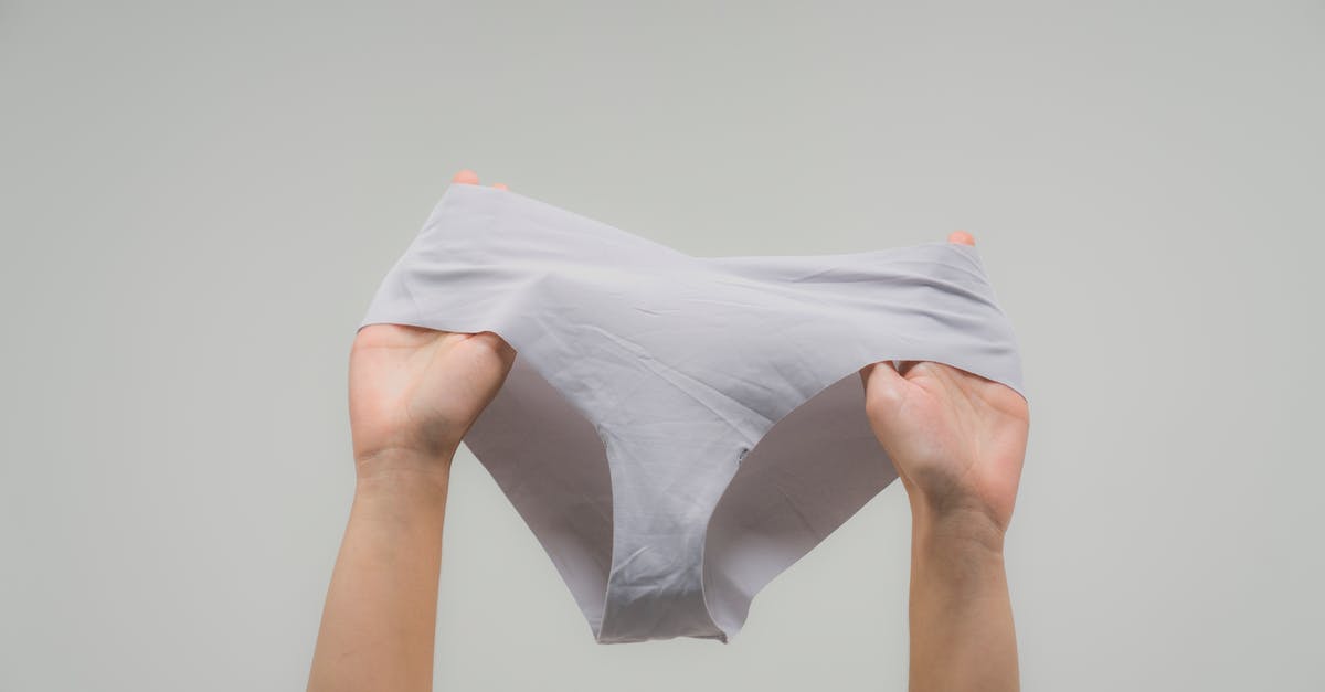 What to do without underwear on a 4 day trip? - Person Holding White Textile What to do without underwear on a 4 day trip? - Person Holding White Textile