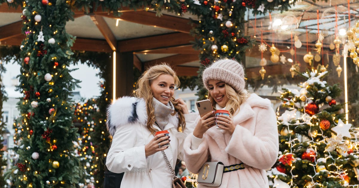 What to wear in Russia - Two Women Near Christmas Decorations What to wear in Russia - Two Women Near Christmas Decorations