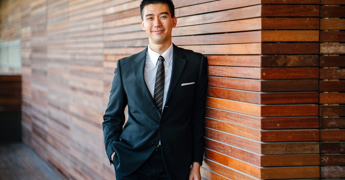 What to wear in Switzerland in July? - Man Wearing Black Suit Jacket and Pants What to wear in Switzerland in July? - Man Wearing Black Suit Jacket and Pants