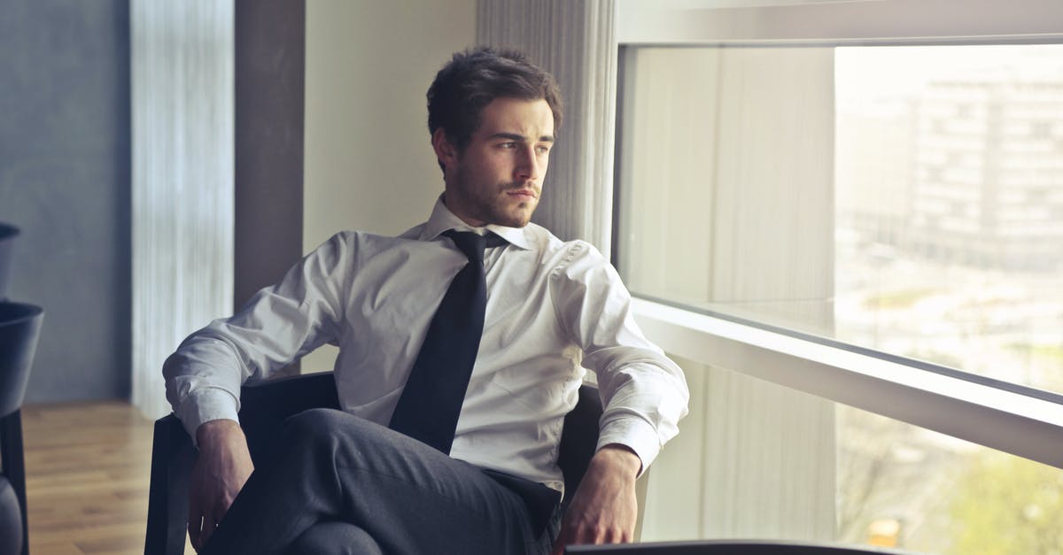 What to wear in Switzerland in July? - Man Wearing White Dress Shirt and Black Necktie What to wear in Switzerland in July? - Man Wearing White Dress Shirt and Black Necktie