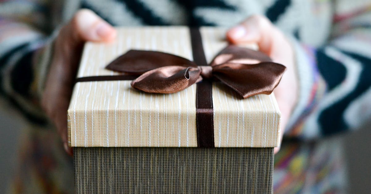 What verification would I need to present for picking up a ticket at the airport? - Brown and White Striped Gift Box What verification would I need to present for picking up a ticket at the airport? - Brown and White Striped Gift Box