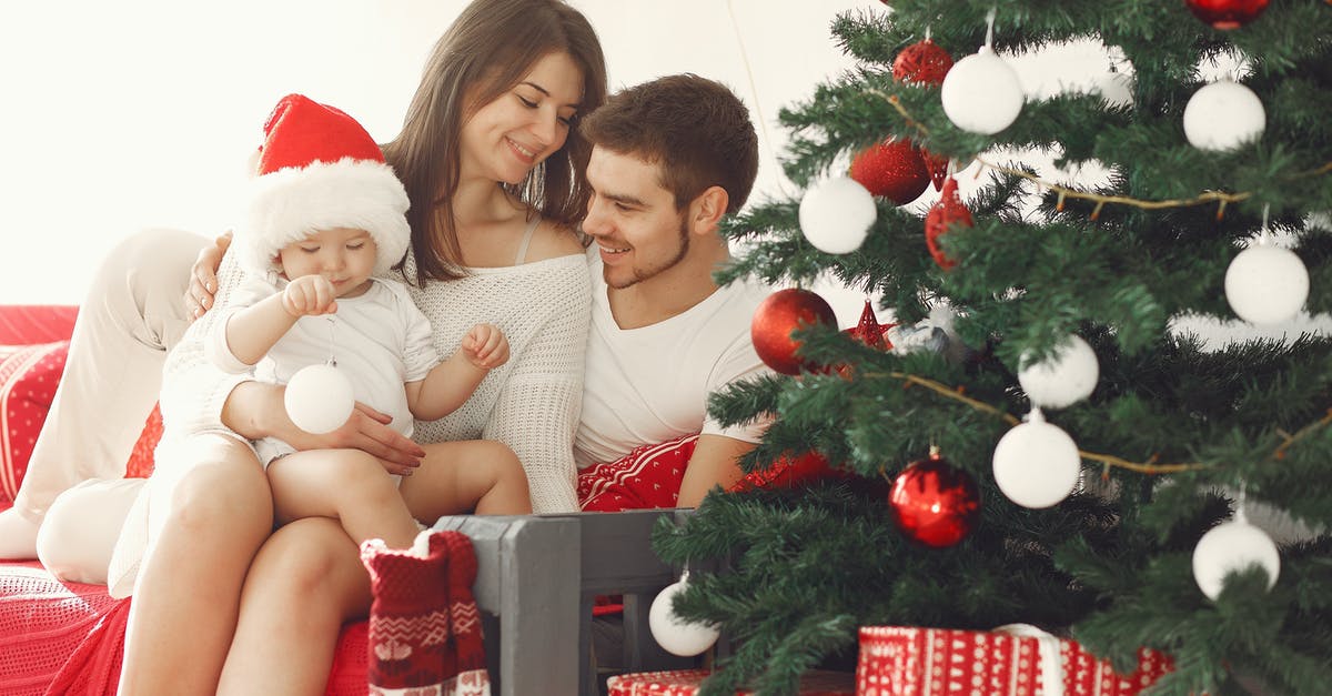 What visa does family need to holiday in New Zealand? - Woman in White Long Sleeve Shirt Sitting Beside Woman in Red Shirt What visa does family need to holiday in New Zealand? - Woman in White Long Sleeve Shirt Sitting Beside Woman in Red Shirt