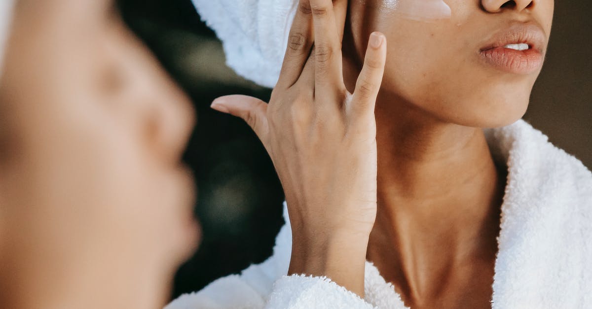 What visa should I apply for as an Au Pair? - Crop unrecognizable young ethnic female in terry robe applying moisturizing cream on cheek while reflecting in mirror What visa should I apply for as an Au Pair? - Crop unrecognizable young ethnic female in terry robe applying moisturizing cream on cheek while reflecting in mirror