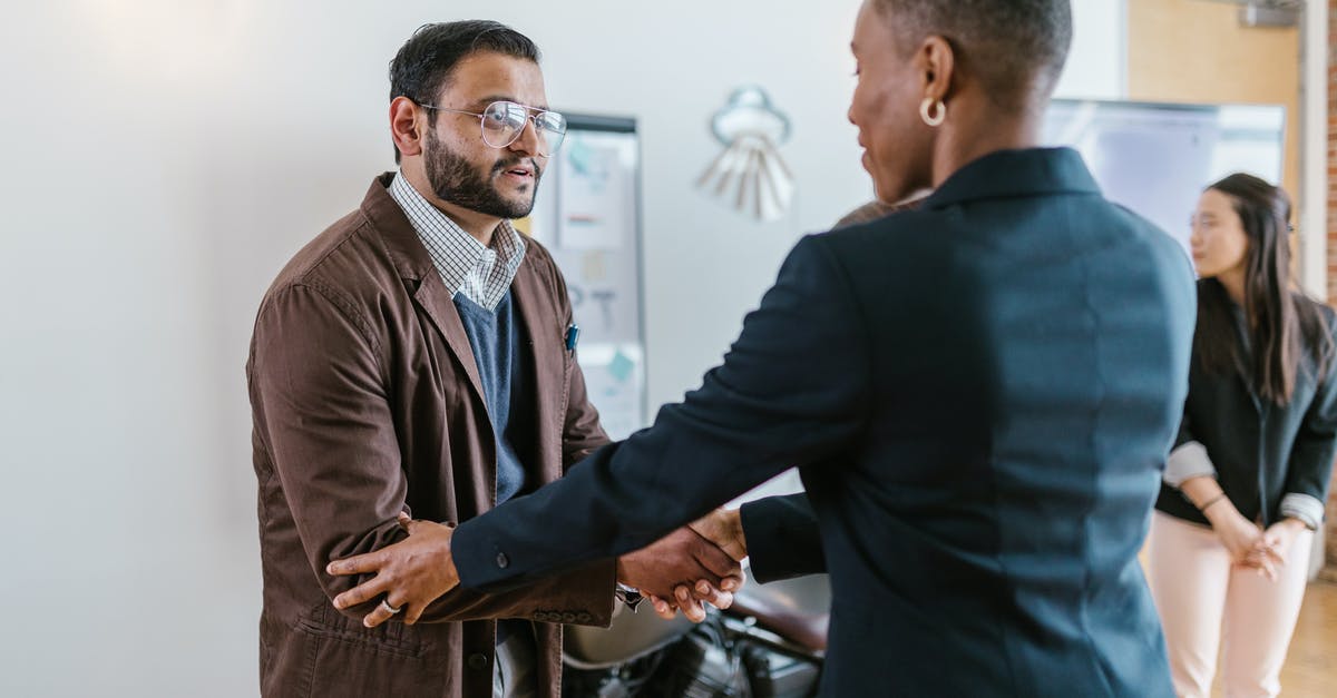 What was the meaning of this Indian gesture/greeting? - A Man and a Woman Shaking Hands Doing Business What was the meaning of this Indian gesture/greeting? - A Man and a Woman Shaking Hands Doing Business