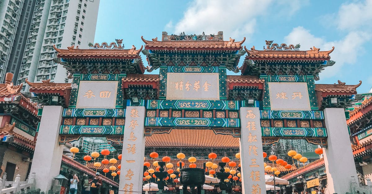 What would be considered "evidence of adequate funds" for entering Hong Kong? - People Walking on Street Near Red and Green Chinese Temple What would be considered "evidence of adequate funds" for entering Hong Kong? - People Walking on Street Near Red and Green Chinese Temple