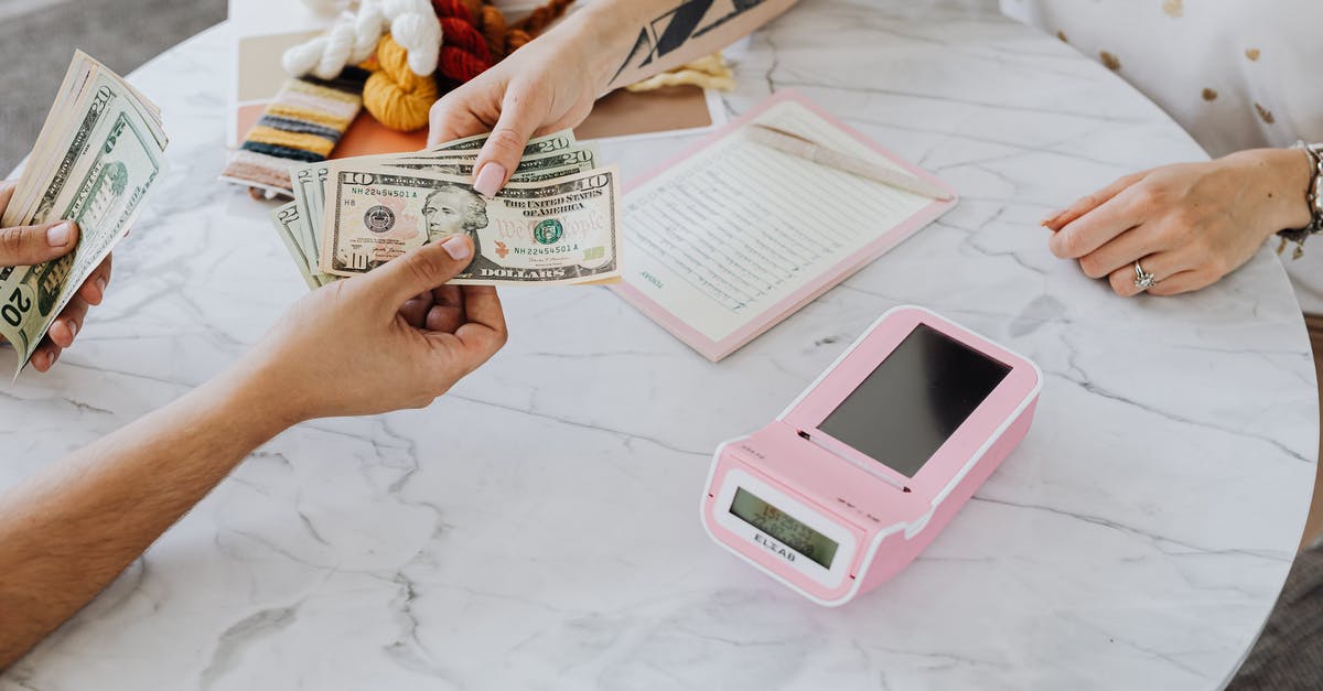 When buying flight with AAdvantage points do you still pay $ at the end? - Hands Holding US Dollar Bills When buying flight with AAdvantage points do you still pay $ at the end? - Hands Holding US Dollar Bills