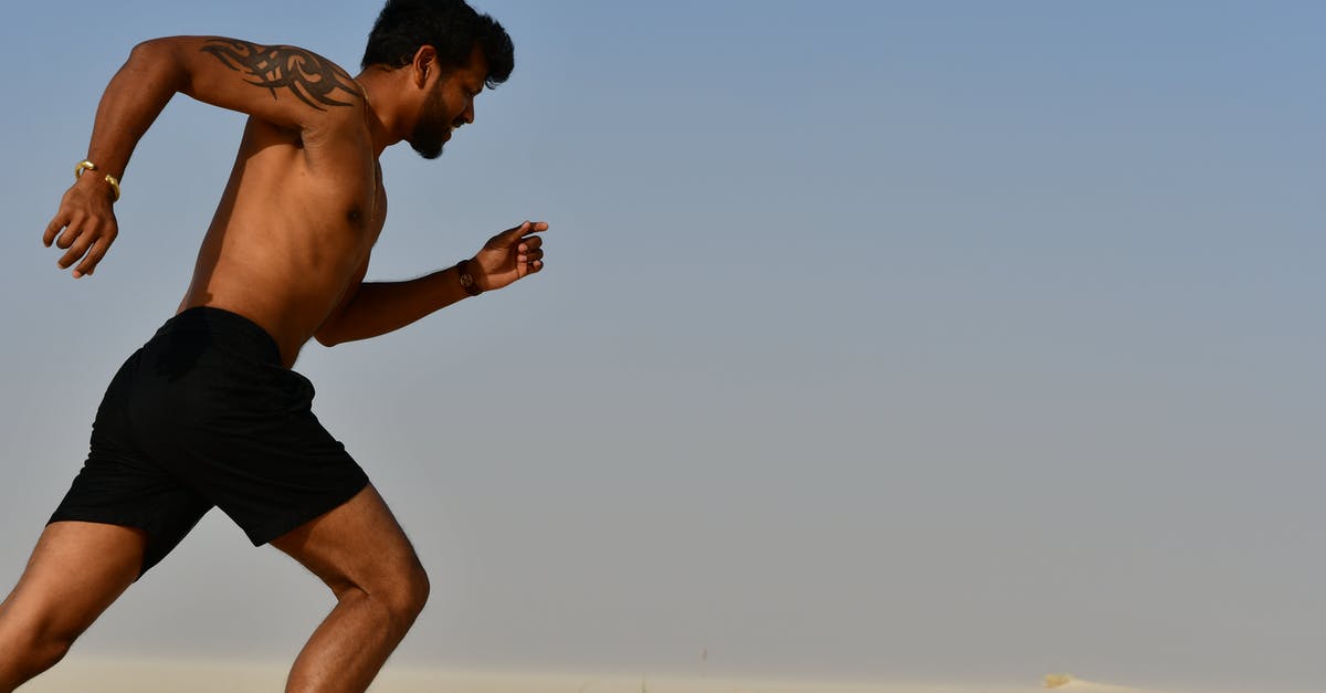 When does the train from Encarnación to Posadas run? - Strong shirtless sportsman jogging on bright day