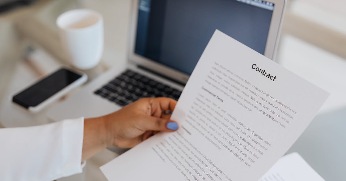 When flying AirAsia, do I need to get my documents checked before going to the gate? - Close-Up View of a Person Holding a Paper When flying AirAsia, do I need to get my documents checked before going to the gate? - Close-Up View of a Person Holding a Paper