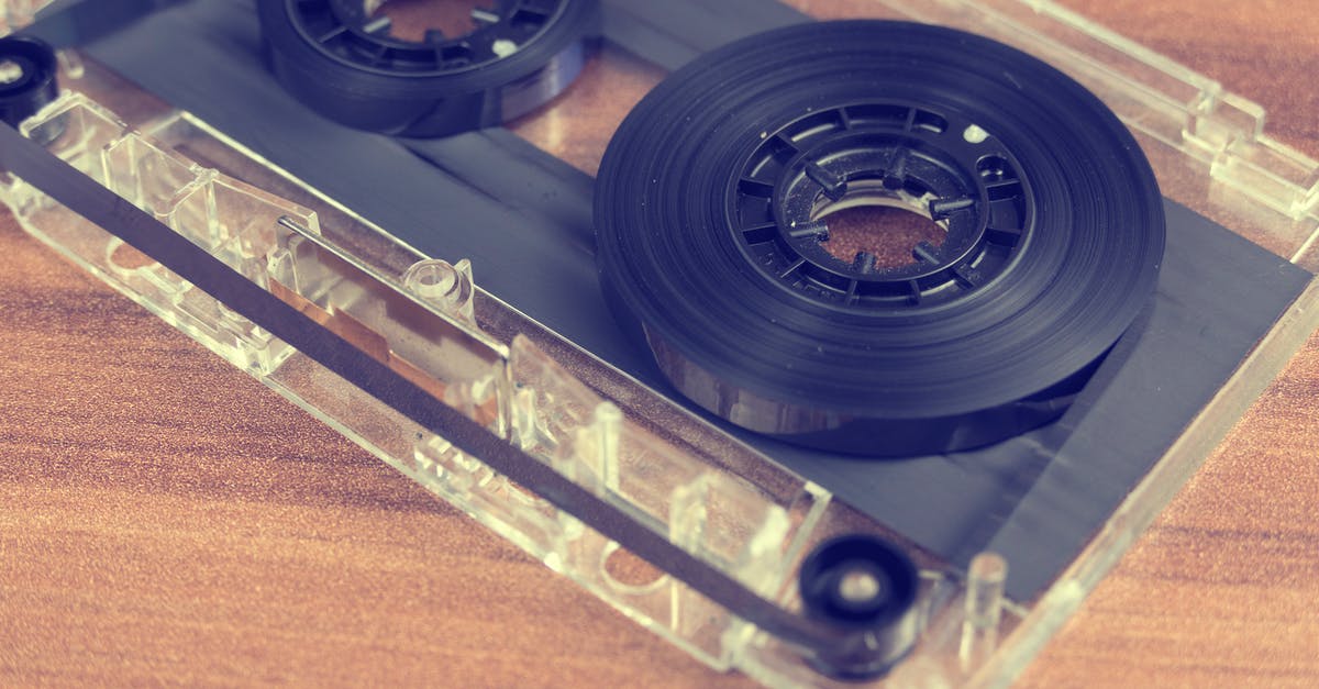 When flying, why is my in-seat audio always broken or too loose? [closed] - Clear and Black Cassette Tape on Brown Wooden Surface