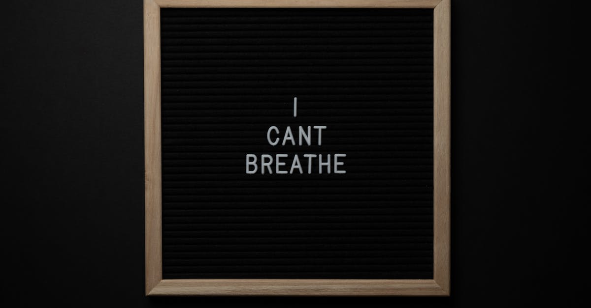 When I swim near Malaga (Spain) what I should pay attention for? - Top view of phrase I Cant Breath on small black signboard with light beige thin frame on black background When I swim near Malaga (Spain) what I should pay attention for? - Top view of phrase I Cant Breath on small black signboard with light beige thin frame on black background