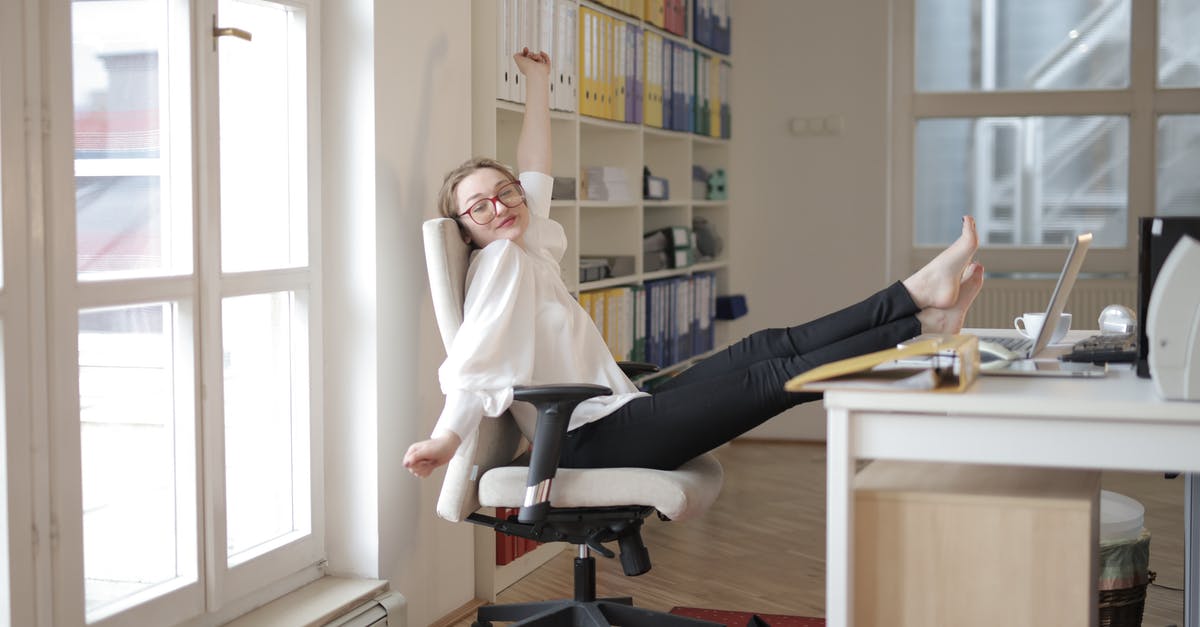 When in a window seat on a plane, how do I deal with people who want the shade closed? - Dreamy female employee relaxing with feet on table in office When in a window seat on a plane, how do I deal with people who want the shade closed? - Dreamy female employee relaxing with feet on table in office