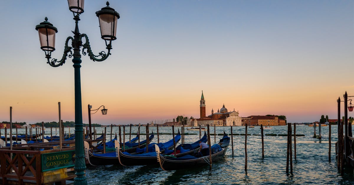 When is the Chiesa di San Maurizio al Monastero Maggiore open? - Green Metal Post in Front of the Body of Ocean With Boats during Twilight When is the Chiesa di San Maurizio al Monastero Maggiore open? - Green Metal Post in Front of the Body of Ocean With Boats during Twilight