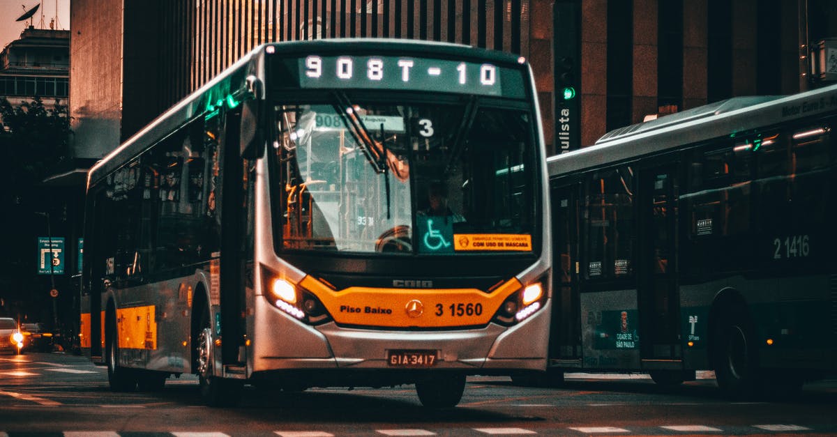 When is the last / overnight bus from Ankara to Göreme (Cappadocia)? - Low angle of modern bus riding on asphalt road amidst building of contemporary city at sunset When is the last / overnight bus from Ankara to Göreme (Cappadocia)? - Low angle of modern bus riding on asphalt road amidst building of contemporary city at sunset