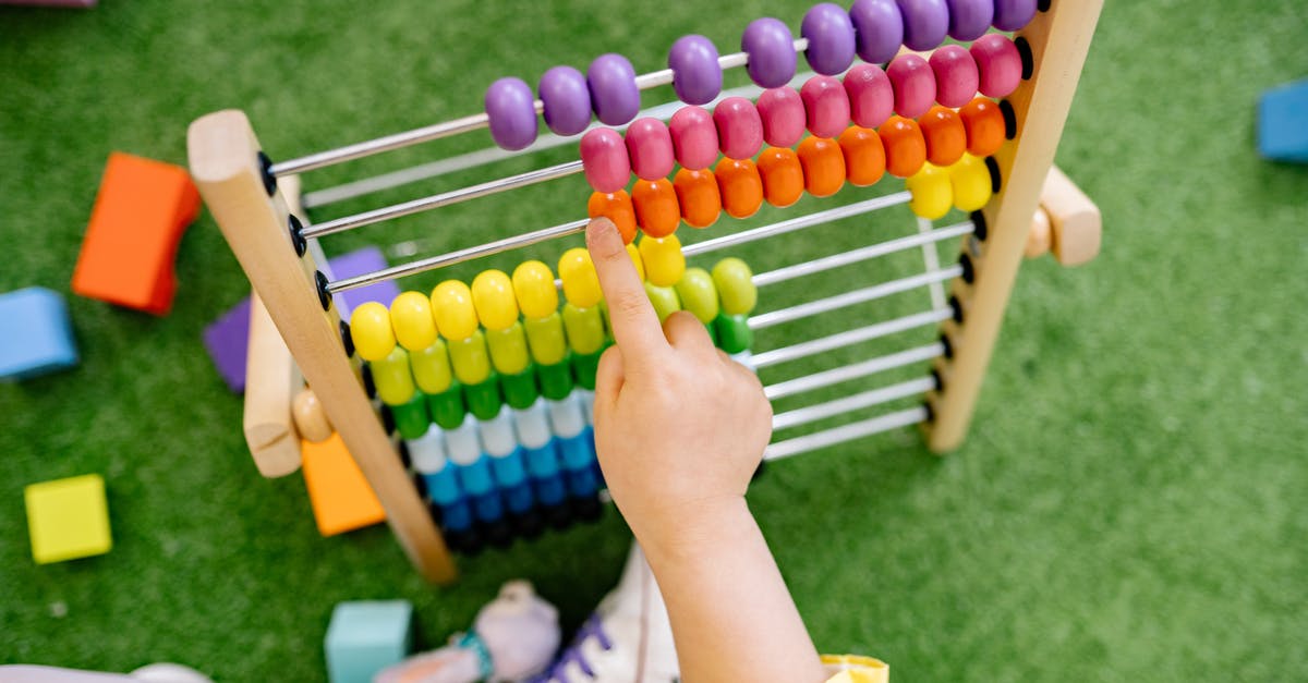 When to count children as guests? - Child Playing With An Abacus and Learning To Count When to count children as guests? - Child Playing With An Abacus and Learning To Count