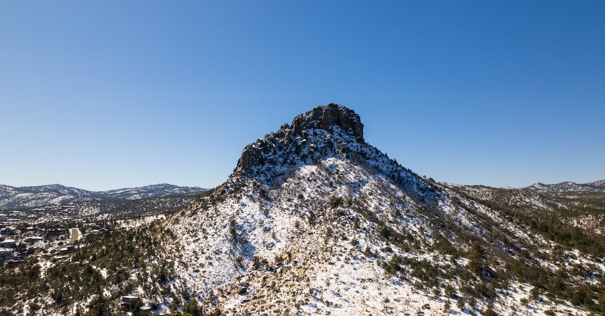 When travel insurance covers natural disasters - White and Green Trees on Mountain Under Blue Sky When travel insurance covers natural disasters - White and Green Trees on Mountain Under Blue Sky