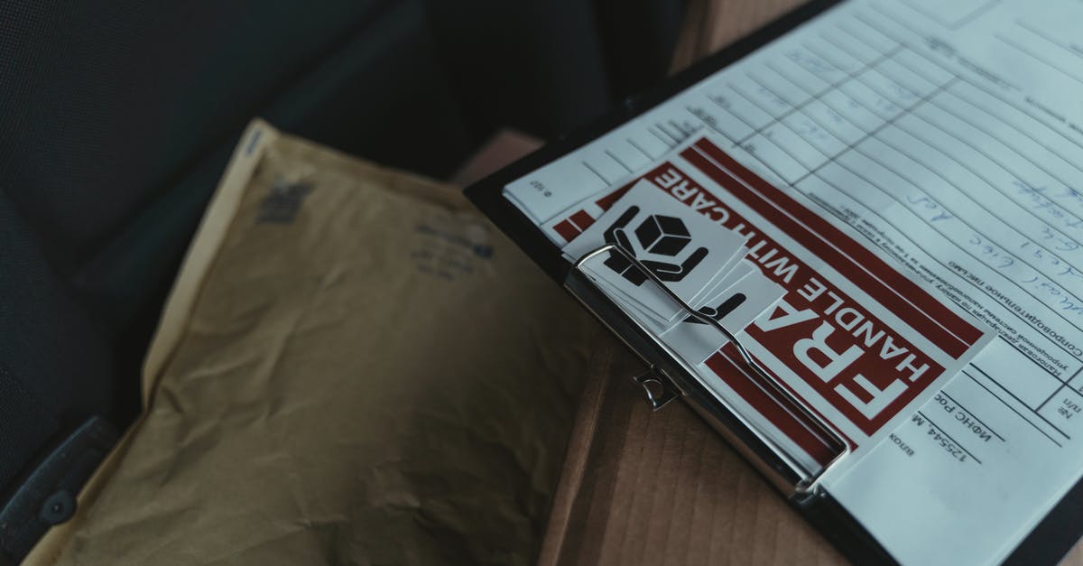 When traveling to Venezuela, what currency should I carry with me - White and Black Box on Brown Wooden Table When traveling to Venezuela, what currency should I carry with me - White and Black Box on Brown Wooden Table
