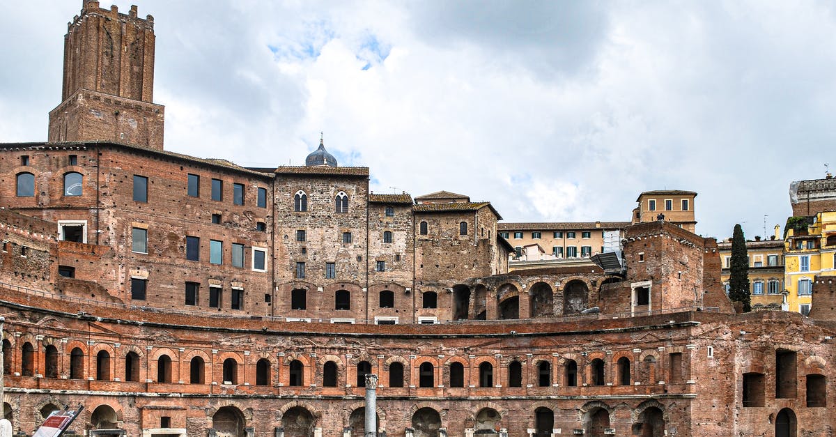 When will the Museum of Roman Civilization in Rome re-open? - Brown Concrete Building Under Cloudy Sky When will the Museum of Roman Civilization in Rome re-open? - Brown Concrete Building Under Cloudy Sky