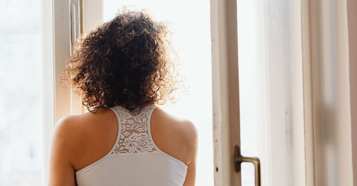When will the Sistine Chapel open after the Papal Conclave? - Woman in White Tank Top Standing Near White Wooden Framed Glass Window When will the Sistine Chapel open after the Papal Conclave? - Woman in White Tank Top Standing Near White Wooden Framed Glass Window