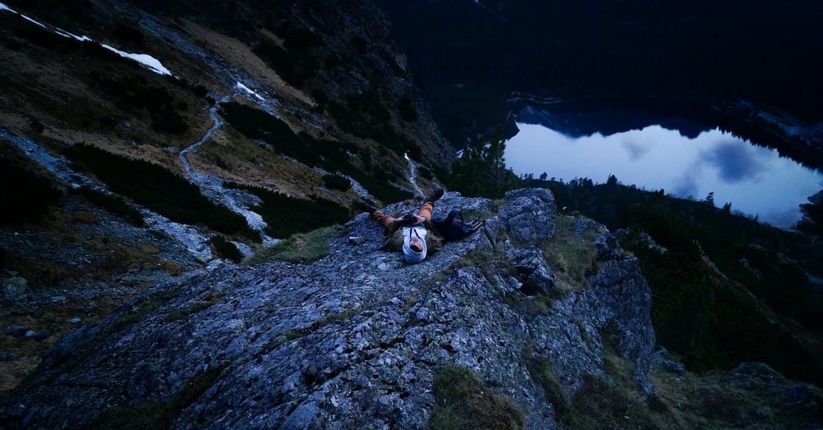 Where's this tarn in Mt Garibaldi? - Person in White on Cliff Near Body of Water Where's this tarn in Mt Garibaldi? - Person in White on Cliff Near Body of Water