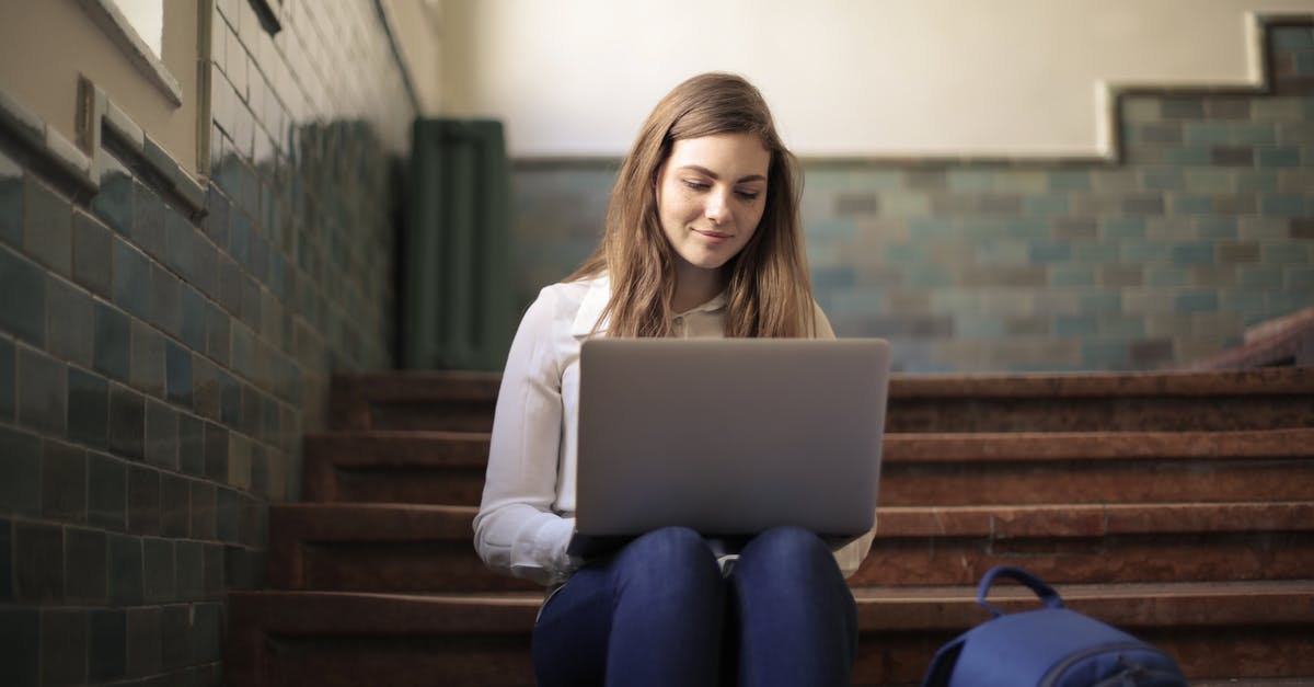 Where can I board an Airbus 380 using stairs instead of jetbridges? - Woman Using a Laptop While Sitting on Stairs Where can I board an Airbus 380 using stairs instead of jetbridges? - Woman Using a Laptop While Sitting on Stairs