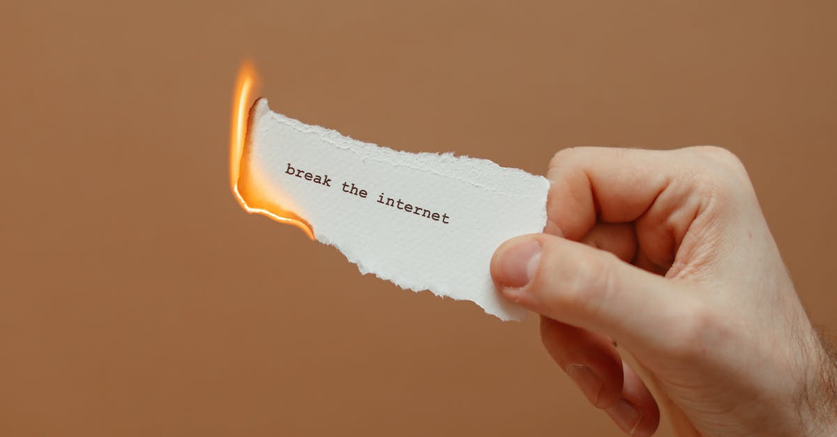 Where can I find tickets to Burning Man event? - Hand Holding a Burning Note Where can I find tickets to Burning Man event? - Hand Holding a Burning Note