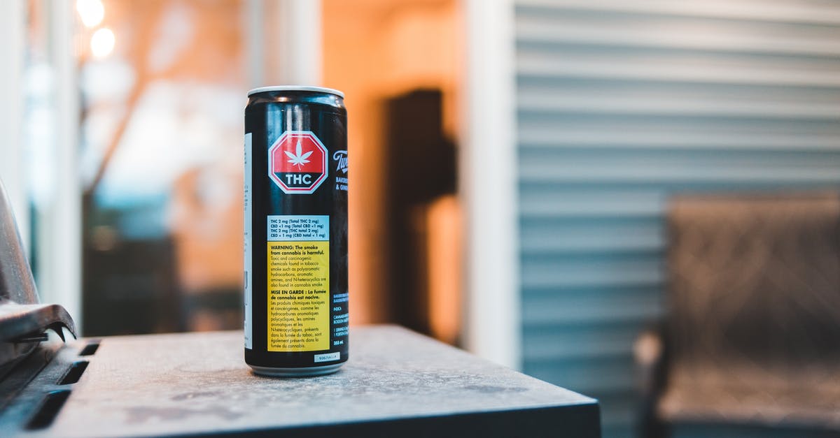 Where can I get information on freighter travel? - Colorful can of cannabis drink with text and image on shiny surface in building Where can I get information on freighter travel? - Colorful can of cannabis drink with text and image on shiny surface in building