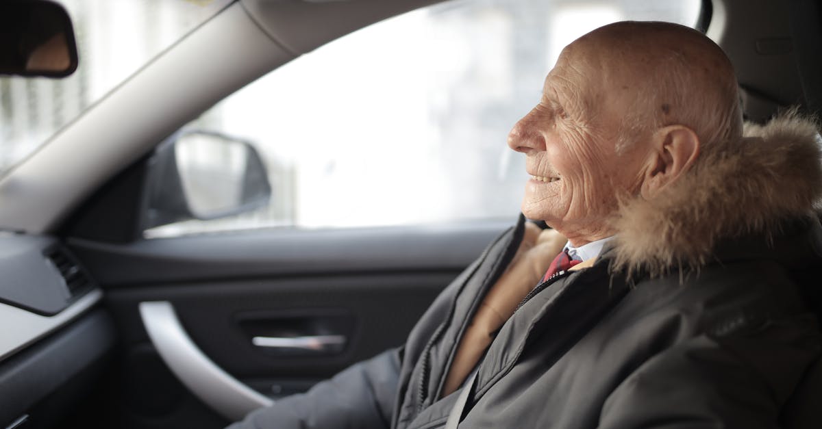 Where can I get insurance for travel in late pregnancy? - Side view of content elderly male in suit and outerwear sitting in front seat of contemporary automobile and looking away Where can I get insurance for travel in late pregnancy? - Side view of content elderly male in suit and outerwear sitting in front seat of contemporary automobile and looking away