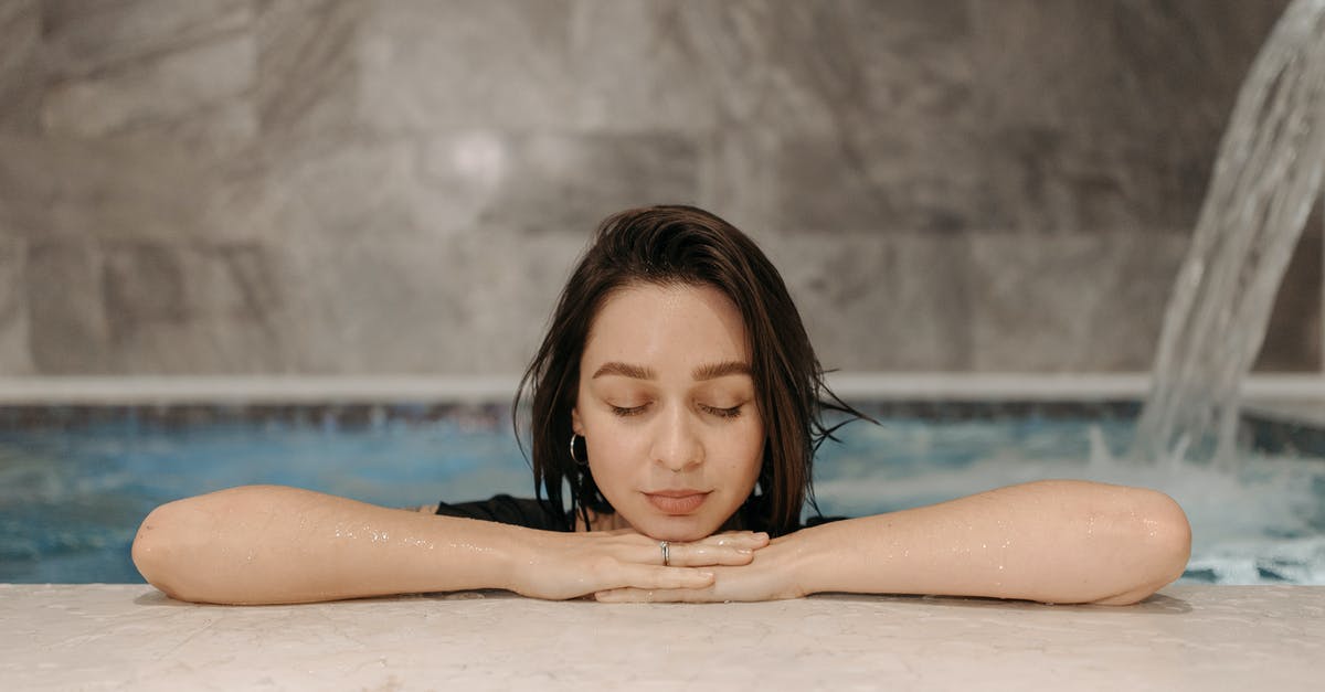 Where can I have a hammam (Turkish bath)? - A Woman with Her Eyes Closed while in a Pool Where can I have a hammam (Turkish bath)? - A Woman with Her Eyes Closed while in a Pool