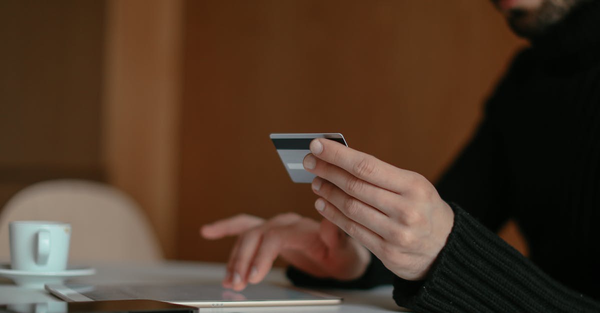Where can I purchase anti venoms? - Close up of a Man Using a Bank Card Online Where can I purchase anti venoms? - Close up of a Man Using a Bank Card Online