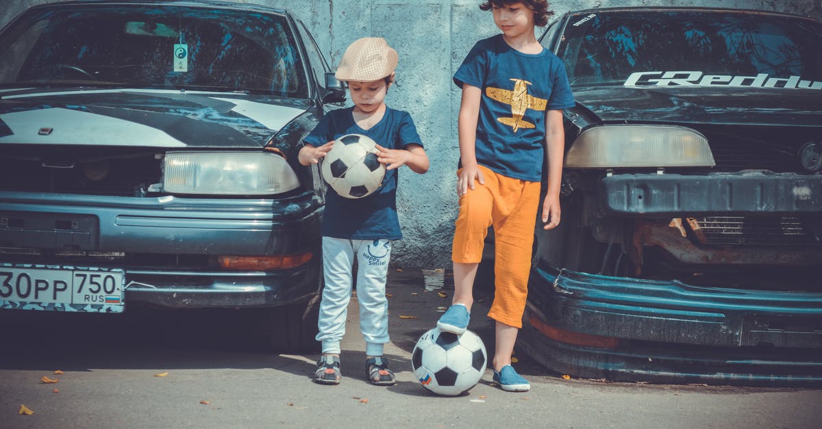 Where can I rent 90's sports cars in Japan? - Two Boys Playing Soccer Ball Beside Cars Where can I rent 90's sports cars in Japan? - Two Boys Playing Soccer Ball Beside Cars