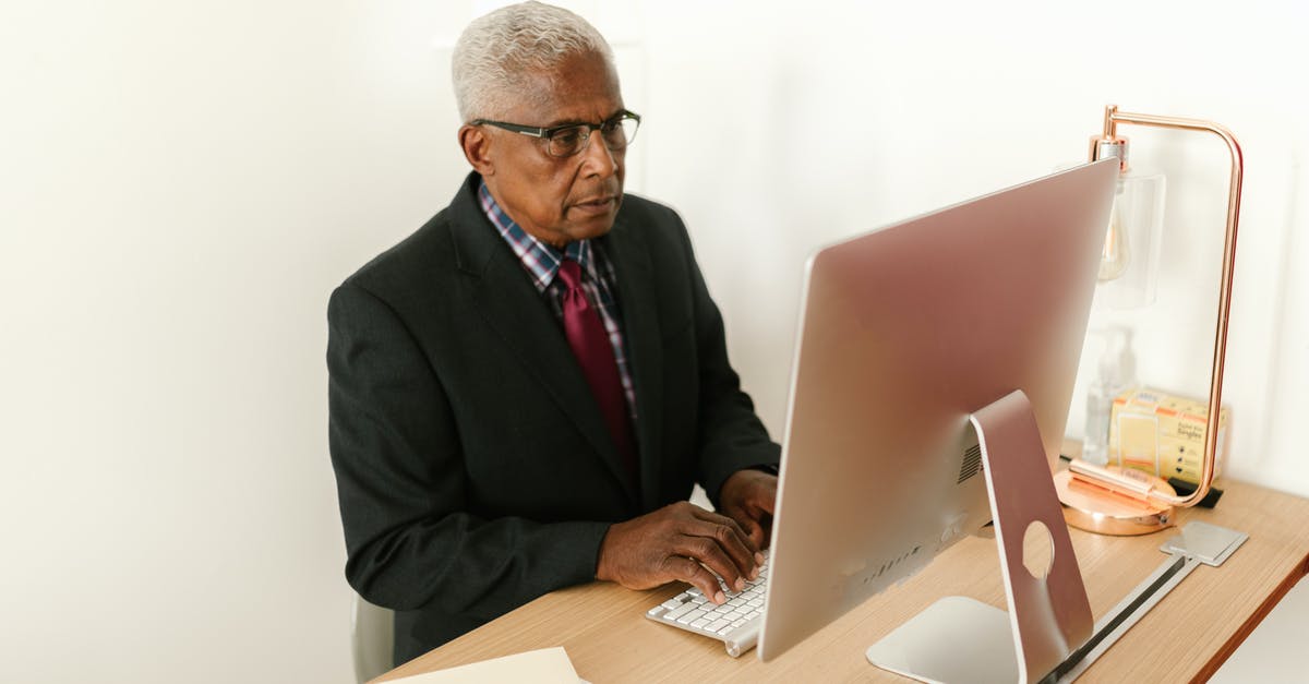 Where can I rent a computer monitor for two weeks in Hong Kong? - Man in Black Suit Jacket Using Macbook Where can I rent a computer monitor for two weeks in Hong Kong? - Man in Black Suit Jacket Using Macbook