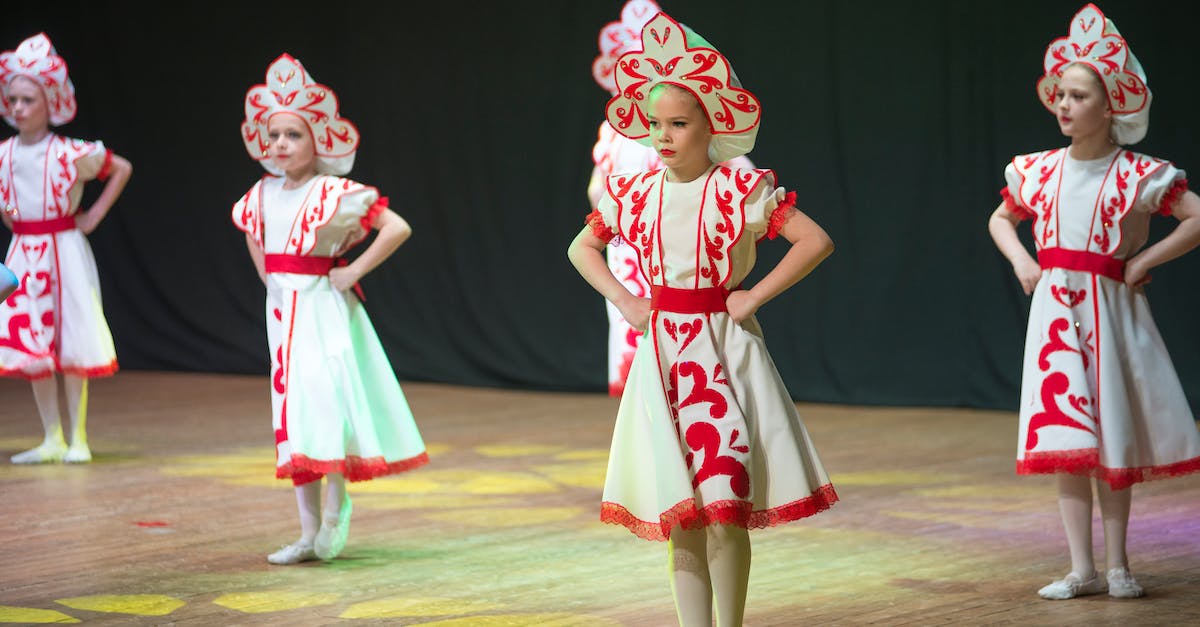 Where can I see a Mbalax performance in Dakar? - 2 Girl in Red and White Dress Standing on Green Field Where can I see a Mbalax performance in Dakar? - 2 Girl in Red and White Dress Standing on Green Field